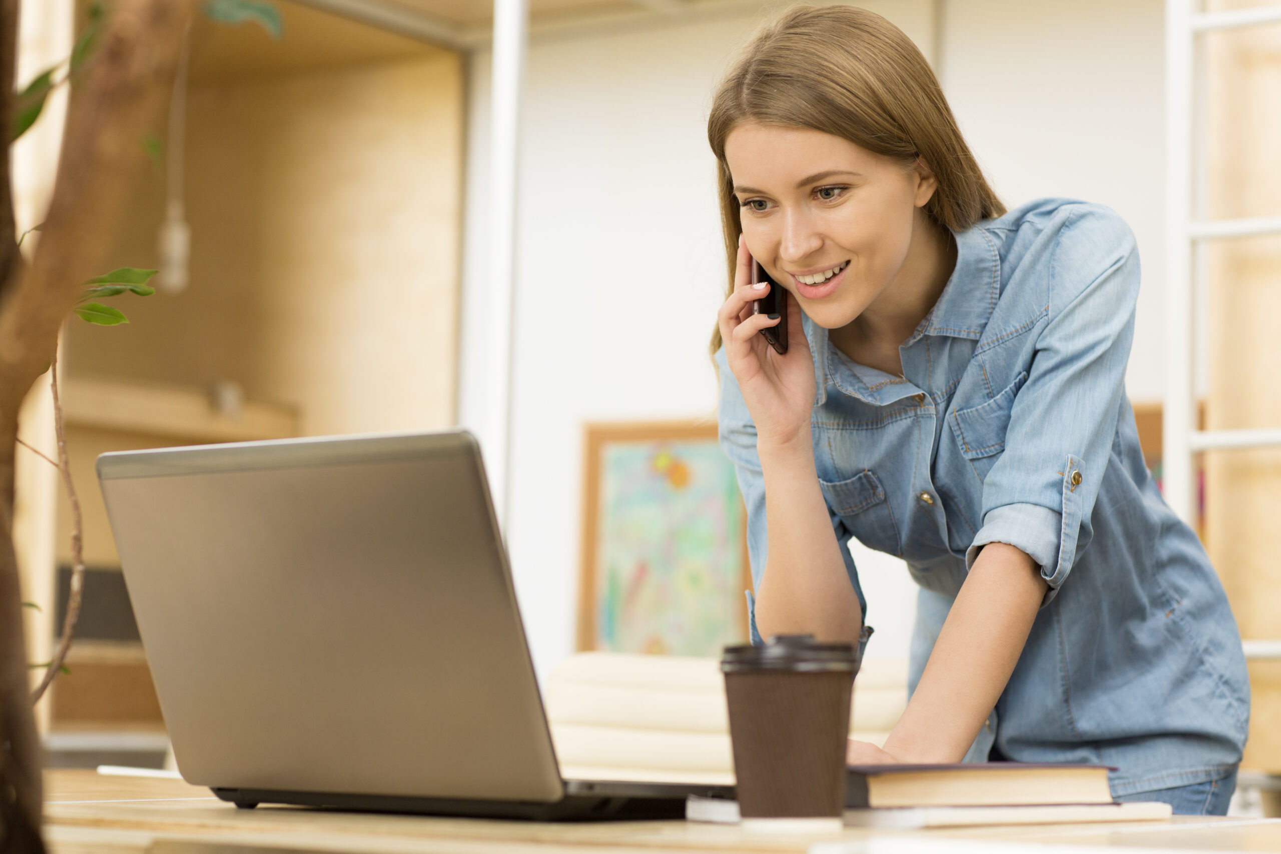 Charming young businesswoman working at the office